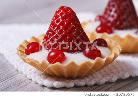tartlets with strawberries, cranberries and cream 20780575