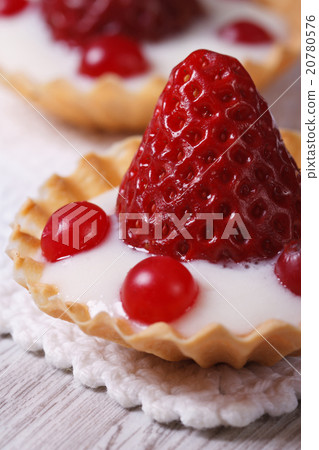 tartlets with strawberries, cranberries and cream 20780576