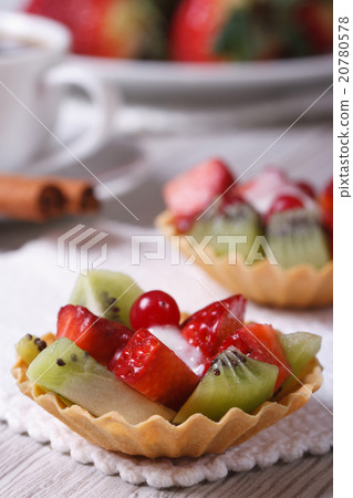 fruit tartlets with strawberries and kiwi vertical 20780578