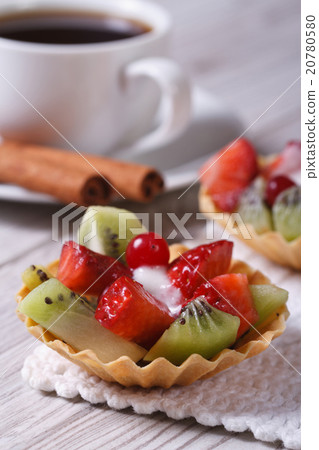 tartlets with strawberries and kiwi with a coffee tartlets with strawberries and kiwi with a coffee 20780580