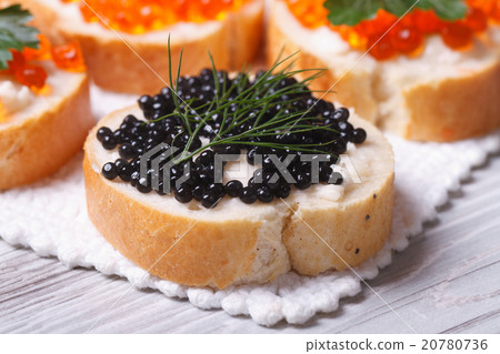Sandwiches with black caviar fish macro 20780736