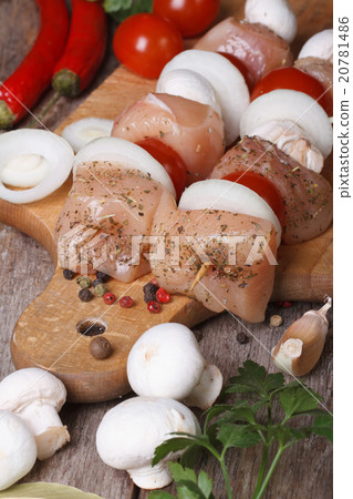 Raw chicken kebabs on wooden skewers vertical Raw chicken kebabs on wooden skewers vertical 20781486