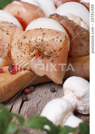Raw chicken barbecue on wooden skewers macro Raw chicken barbecue on wooden skewers macro 20781489