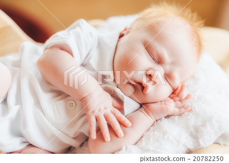 Newborn baby boy with pajamas sleeping in basket Newborn baby boy with pajamas sleeping in basket 20782250