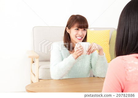 A woman talking with a friend 20782886