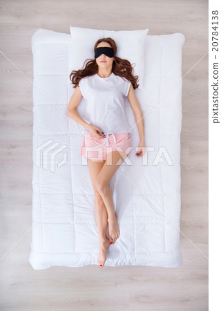 Charming woman lying in bed Charming woman lying in bed 20784138