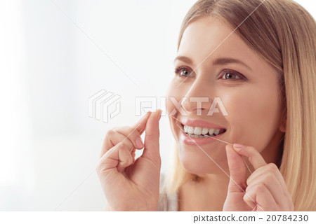 Cleaning teeth after tasty breakfast 20784230
