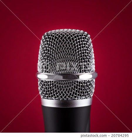 Wireless microphone on red background 20784295