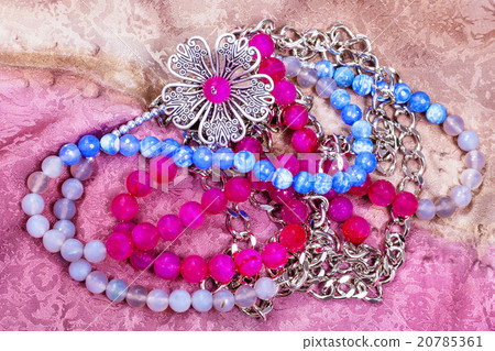 tangled necklace from gemstones with metal flower 20785361