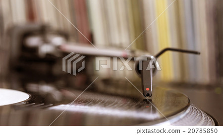 Dj stylus on spinning vinyl, record background 20785850