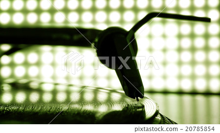 Dj needle stylus on record, blur light background 20785854