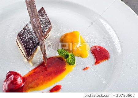 sweet white-brown chocolate dessert with fruits sweet white-brown chocolate dessert with fruits 20786603
