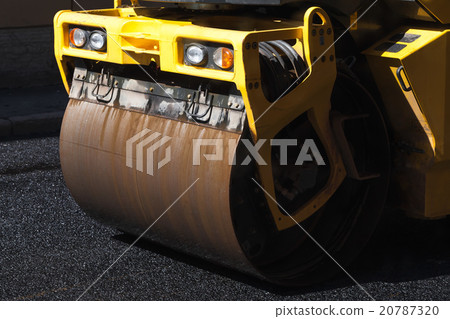 Fragment of yellow roller, road under construction Fragment of yellow roller, road under construction 20787320