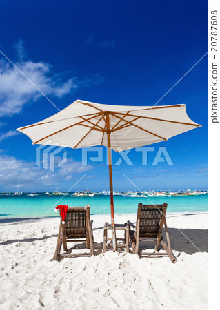 Sun umbrella with Santa Claus Hat on chairs Sun umbrella with Santa Claus Hat on chairs 20787608