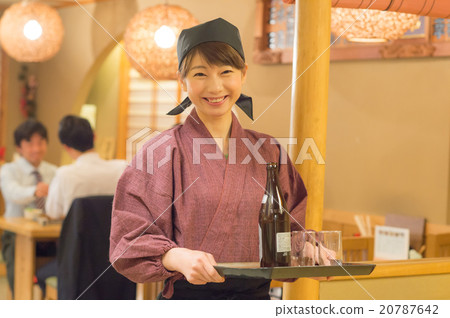 A woman working in a pub in a pub 20787642