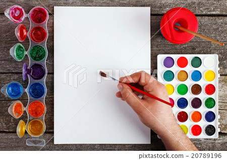 hand with brush painting and watercolor hand with brush painting and watercolor 20789196