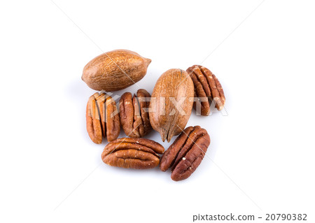 Few pecan nuts isolated on white Few pecan nuts isolated on white 20790382