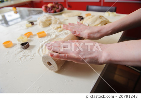 Closeup of woman hand with rolling baking cookies Closeup of woman hand with rolling baking cookies 20791248