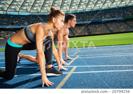 Young sporty people at large modern stadium Young sporty people at large modern stadium 20794256