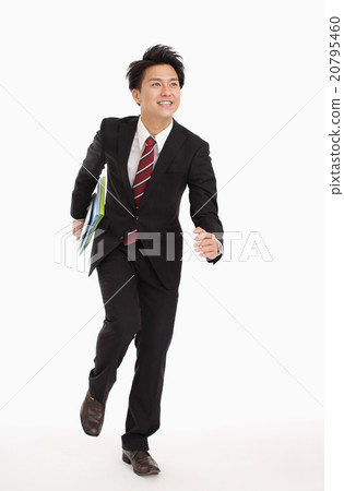 A businessman looking at a tablet 20795460