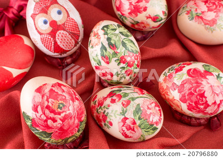Decorated Easter eggs on red silk 20796880