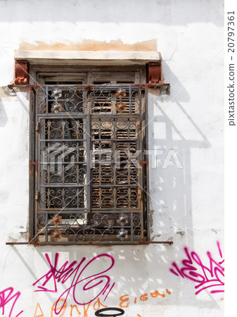 Old window and house with graffiti 20797361