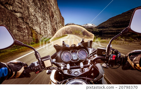 Biker First-person view, mountain serpentine. Biker First-person view, mountain serpentine. 20798370