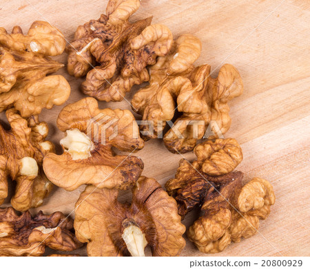 Close up of walnut kernels on wood table. 20800929