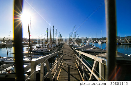 Security gates at entrance of dock.  Boats await. 20801143