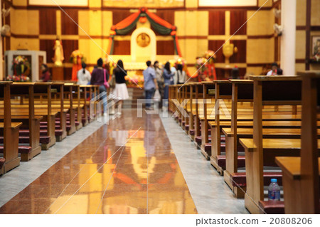 Stained glass windows in small church with wood pews Stained glass windows in small church with wood pews 20808206