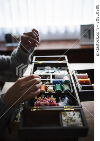 A woman sewing 20810989