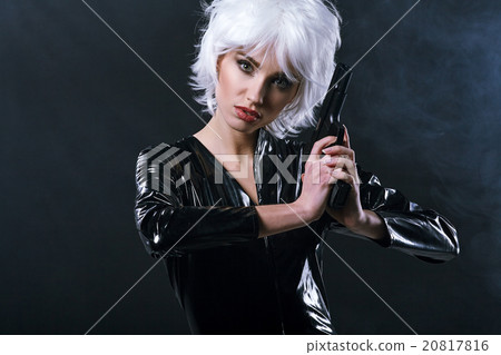 beautiful sexy girl holding gun . smoke background beautiful sexy girl holding gun . smoke background 20817816