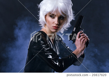 beautiful sexy girl holding gun . smoke background 20817820