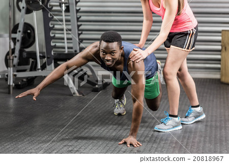 Fit couple doing exercises Fit couple doing exercises 20818967