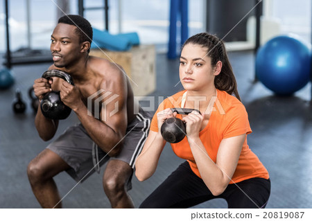 Athletic man and woman working out Athletic man and woman working out 20819087