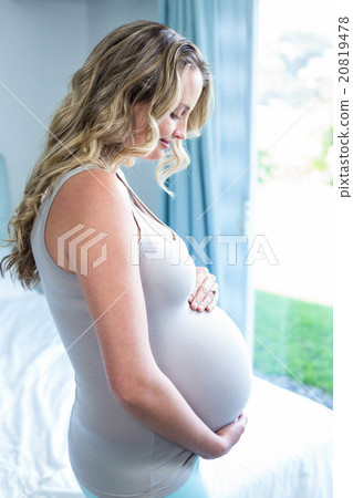 Pregnant woman touching her belly Pregnant woman touching her belly 20819478