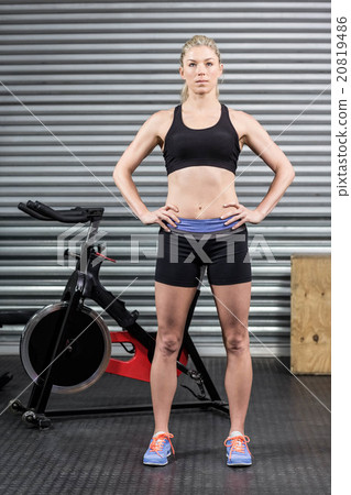 Fit woman with hands on hips Fit woman with hands on hips 20819486