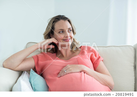 Pregnant woman touching her belly 20819491