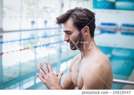 Focused man with hands together Focused man with hands together 20819547