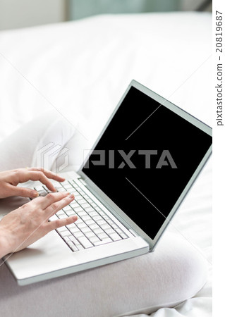 Feminine hands typing on laptop 20819687