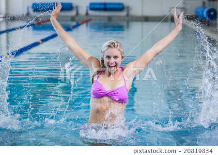 Pretty woman doing aqua aerobics Pretty woman doing aqua aerobics 20819834