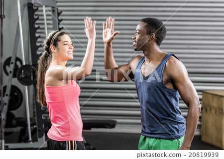 Fit couple doing high five Fit couple doing high five 20819939