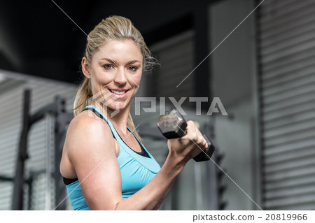 Fit woman lifting dumbbells Fit woman lifting dumbbells 20819966