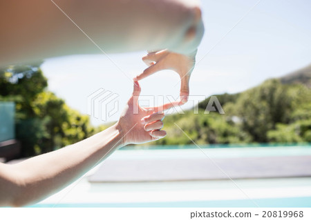 Woman making square with hands Woman making square with hands 20819968