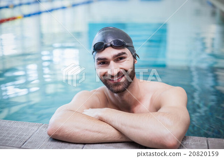 Smiling man wearing swim cap and goggles Smiling man wearing swim cap and goggles 20820159