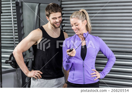 Female trainer showing timer 20820554