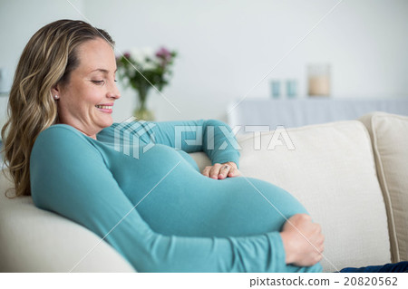 Pregnant woman touching her belly Pregnant woman touching her belly 20820562