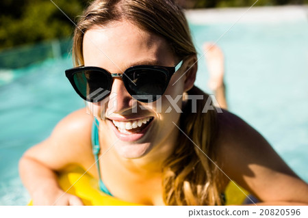 Smiling blonde with inflatable 20820596