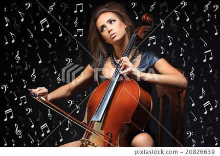 Pretty young female musician playing the cello Pretty young female musician playing the cello 20826639