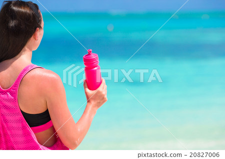 Fit young woman on tropical white beach in her Fit young woman on tropical white beach in her 20827006
